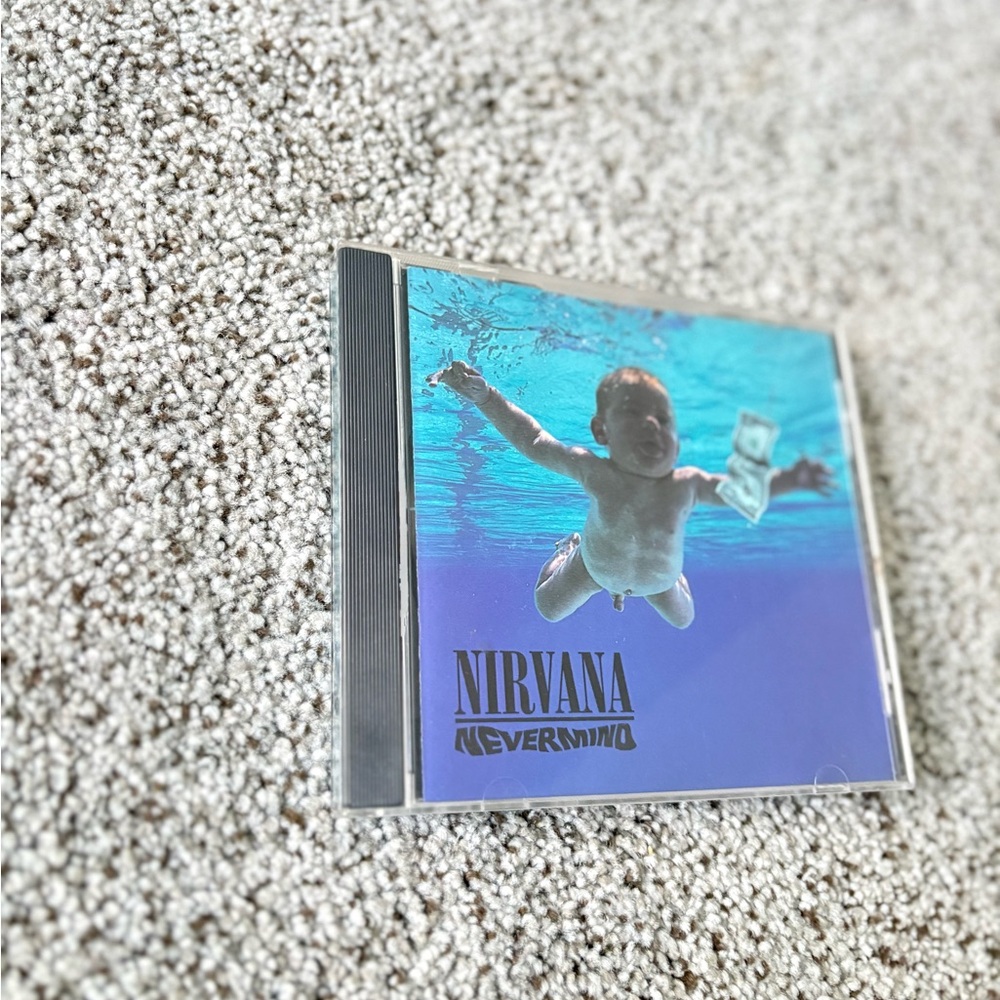 NIRVANA Nevermind CD with Blue and Black Swimming Kid Cover